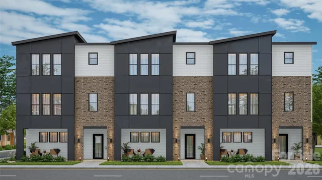 a front view of a building and trees
