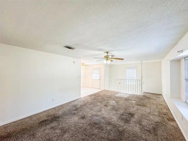 a view of empty room with windows