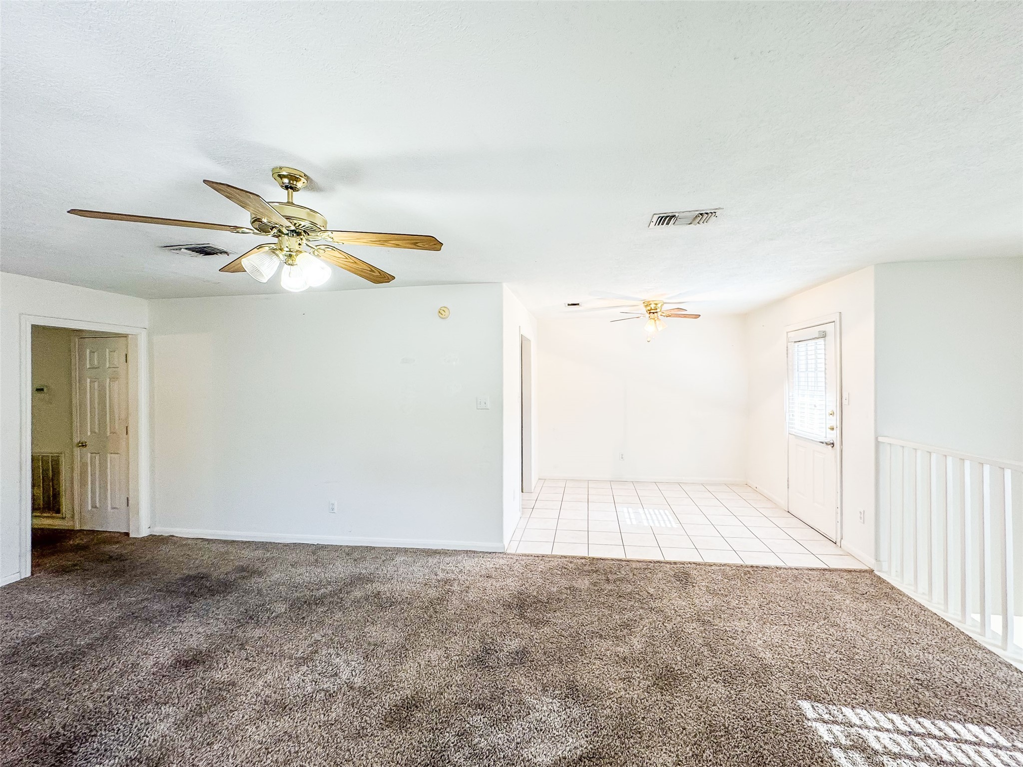 2006 Kilgore Road, Unit 101 Baytown, TX 77520 - Photo 7 of 20 a view of a livingroom with a ceiling fan and window