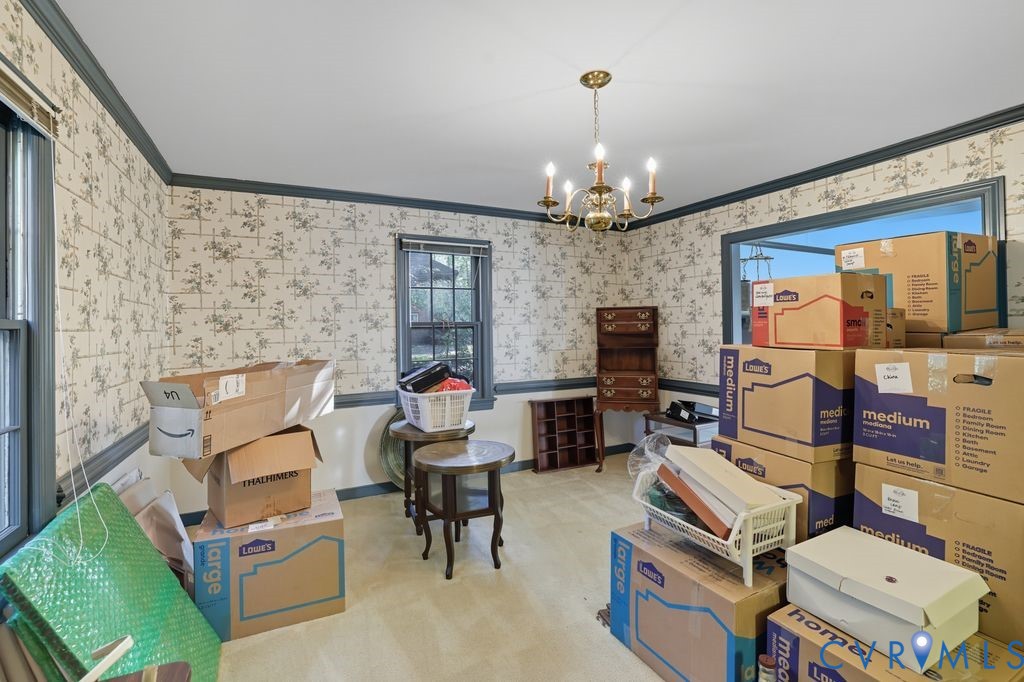12805 Gloria Court Chester, VA 23831 - Photo 17 of 39 a living room with furniture a flat screen tv and kitchen view