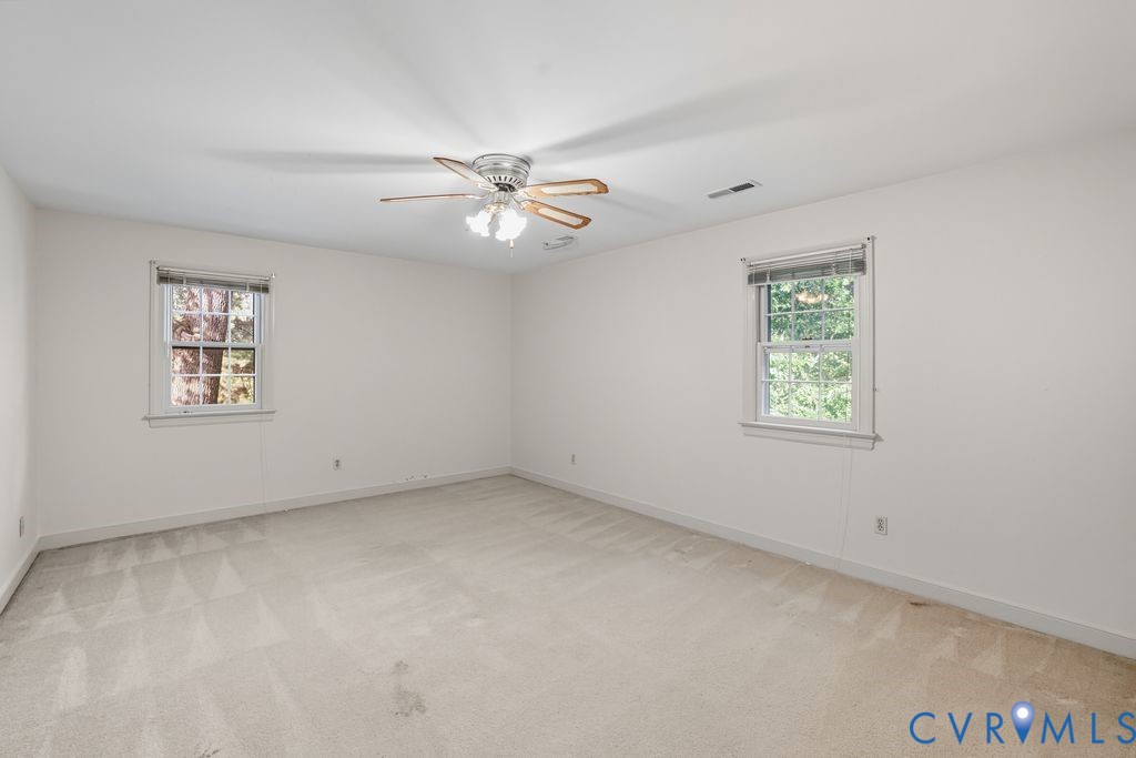12805 Gloria Court Chester, VA 23831 - Photo 24 of 39 an empty room with a window and a fan