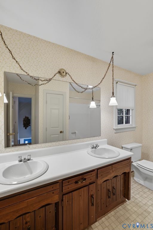 12805 Gloria Court Chester, VA 23831 - Photo 25 of 39 a bathroom with a double vanity sink and a mirror