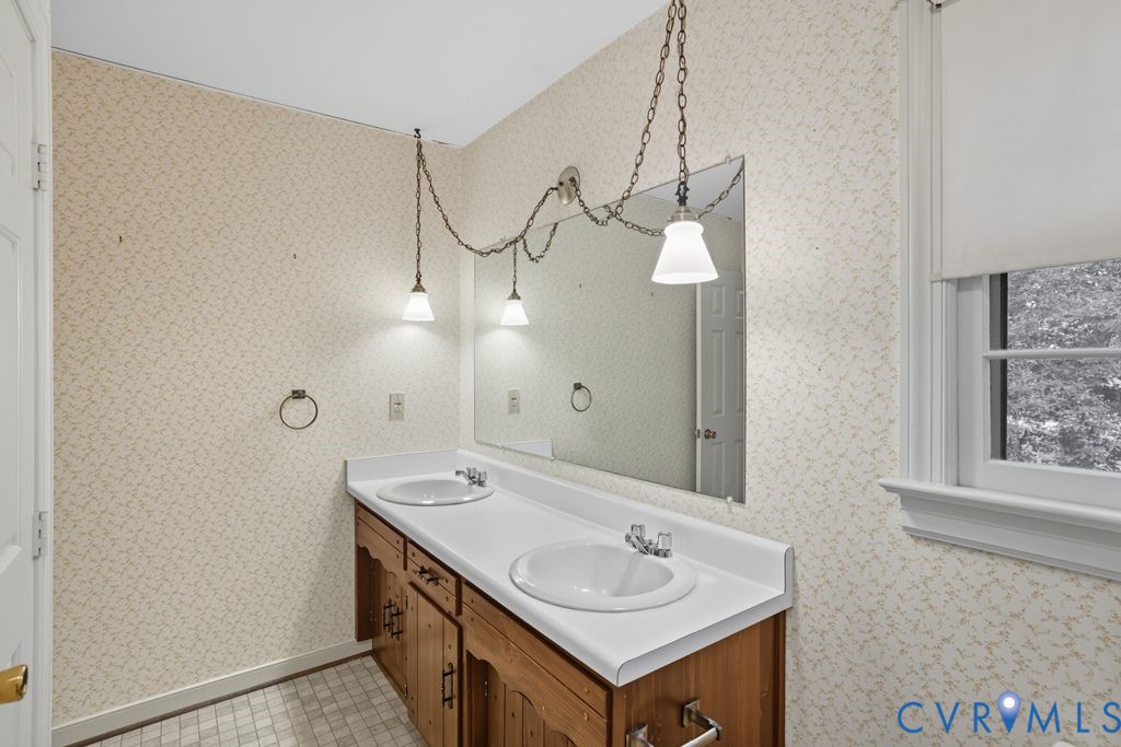 12805 Gloria Court Chester, VA 23831 - Photo 26 of 39 a bathroom with a sink and a mirror