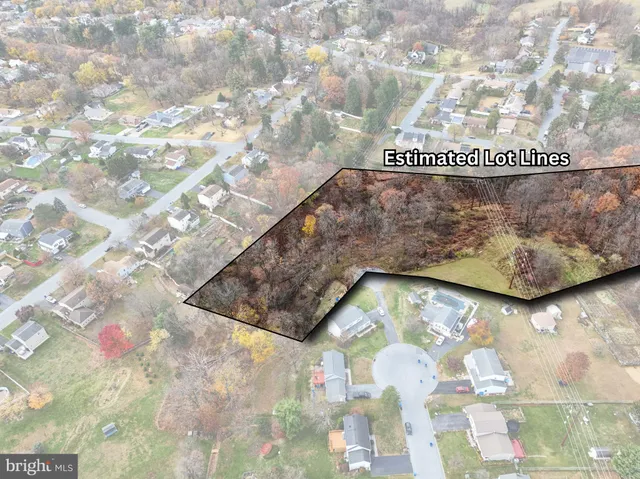 an aerial view of residential house with outdoor space and swimming pool