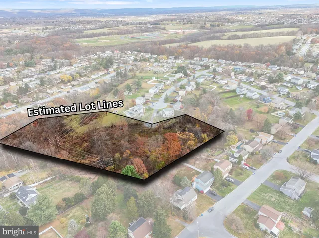 an aerial view of residential building with parking space