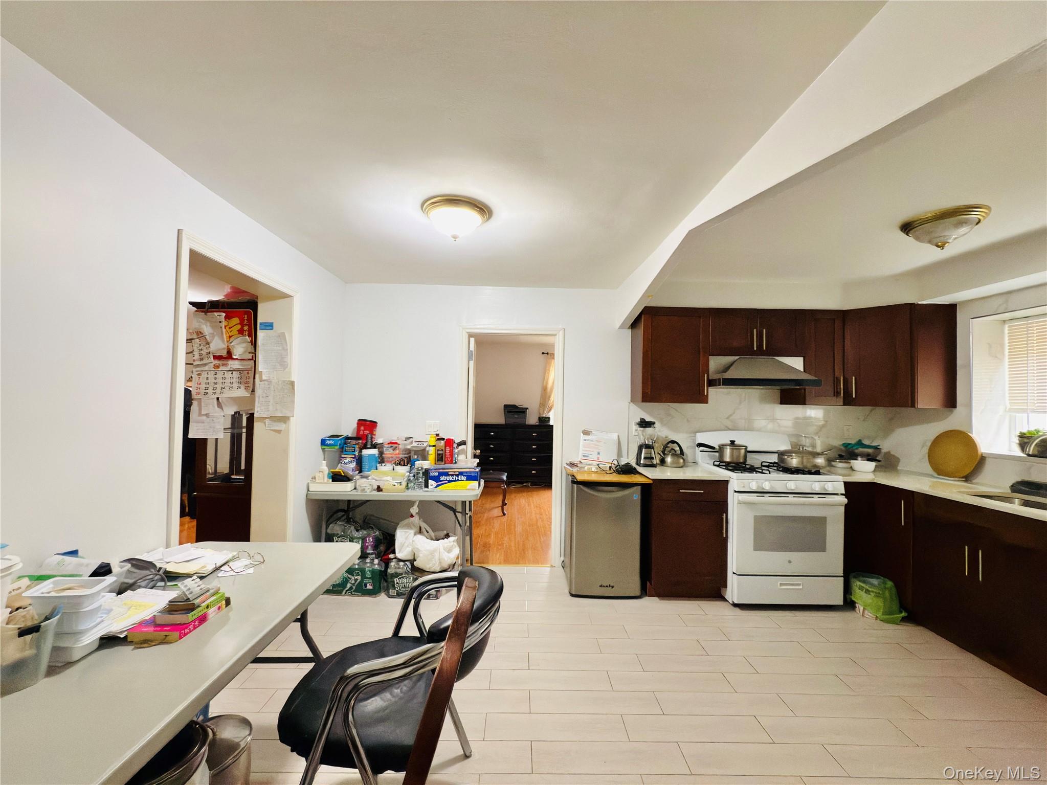 2154 Haight Avenue Bronx, NY 10461 - Photo 13 of 40 a kitchen with a table and chairs in it