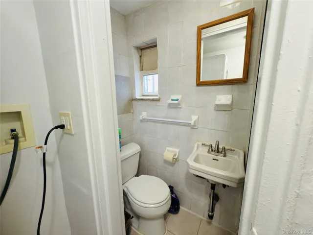 a view of a chairs and table in the balcony