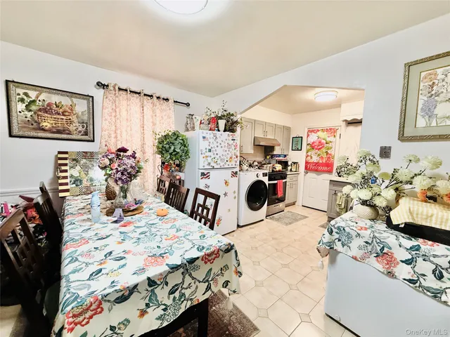 a utility room with sink dryer and washer