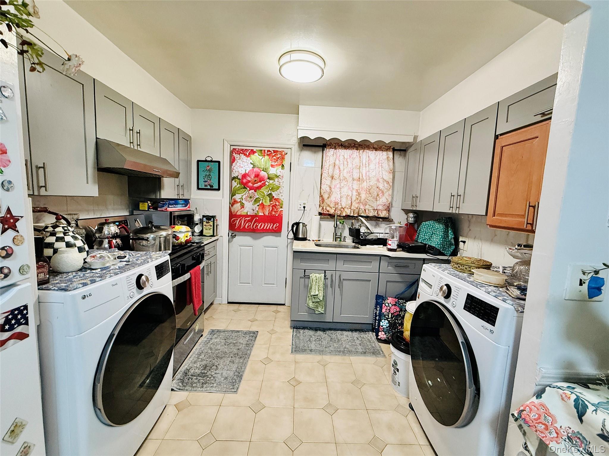2154 Haight Avenue Bronx, NY 10461 - Photo 22 of 40 a utility room with sink dryer and washer