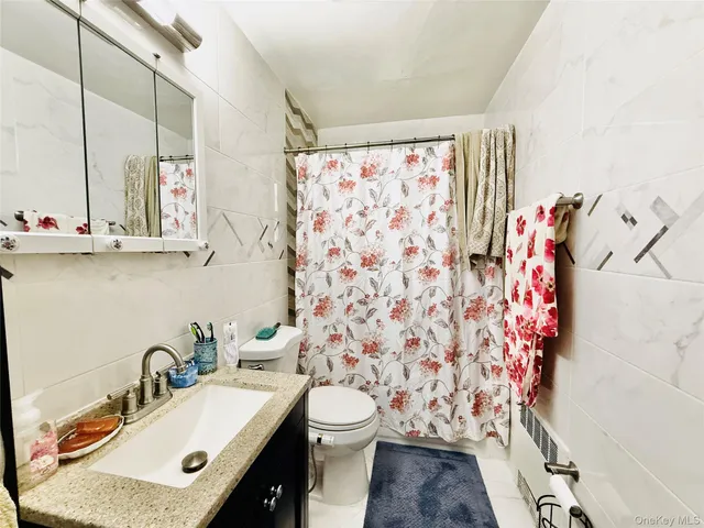 a view of a livingroom with furniture and a window