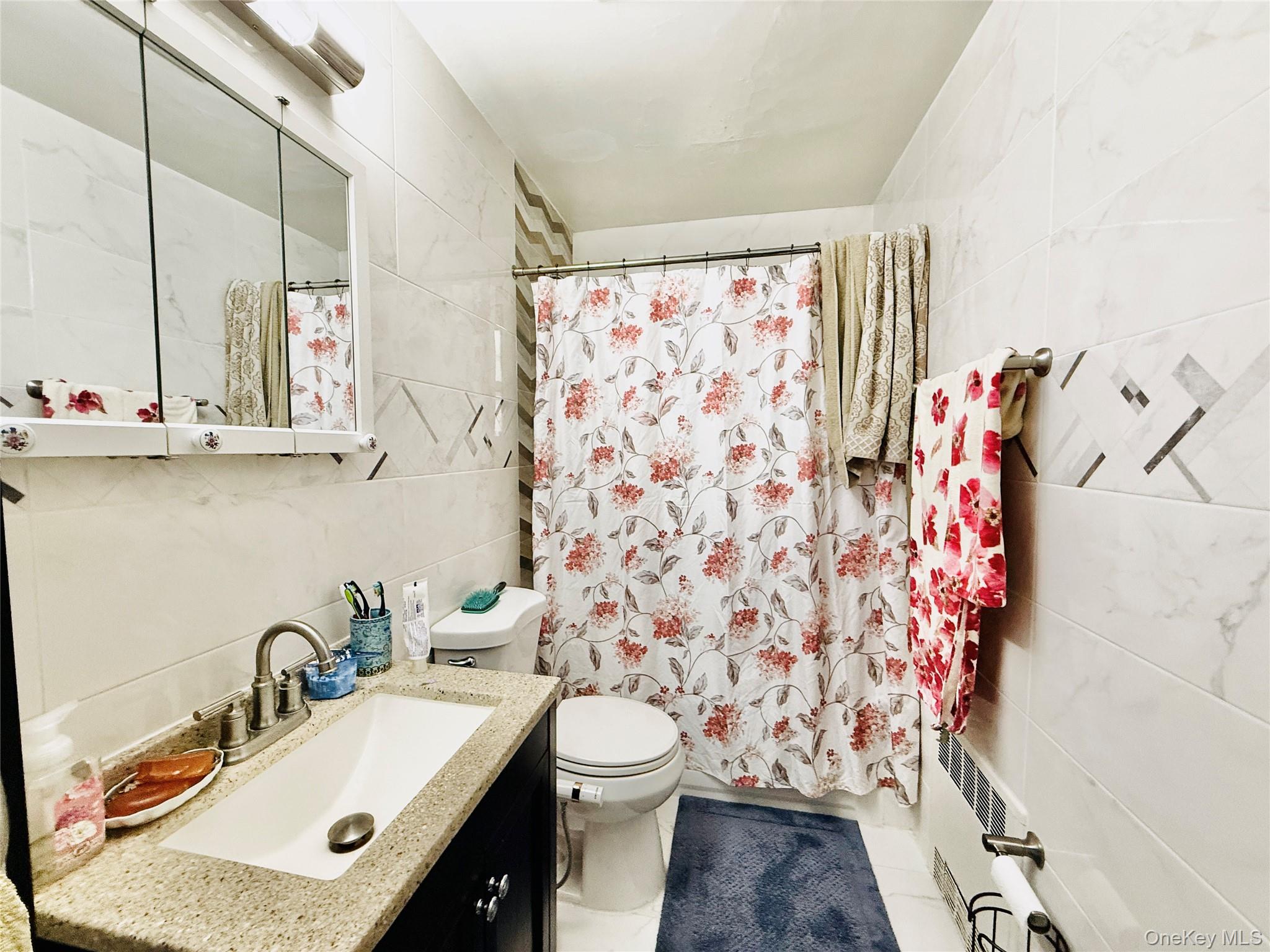 2154 Haight Avenue Bronx, NY 10461 - Photo 26 of 40 a bathroom with a sink toilet and shower