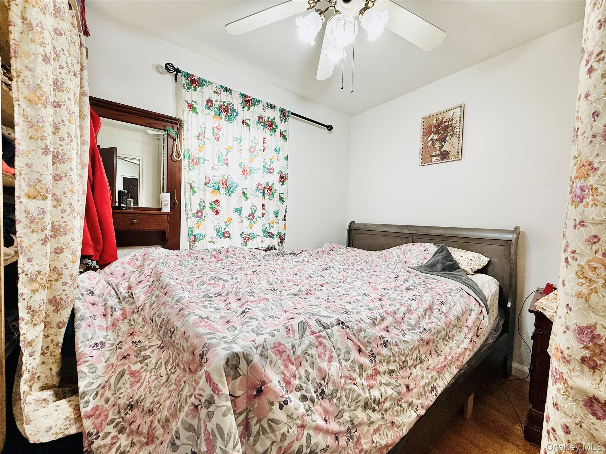 2154 Haight Avenue Bronx, NY 10461 - Photo 29 of 40 a bedroom with bed and a chandelier