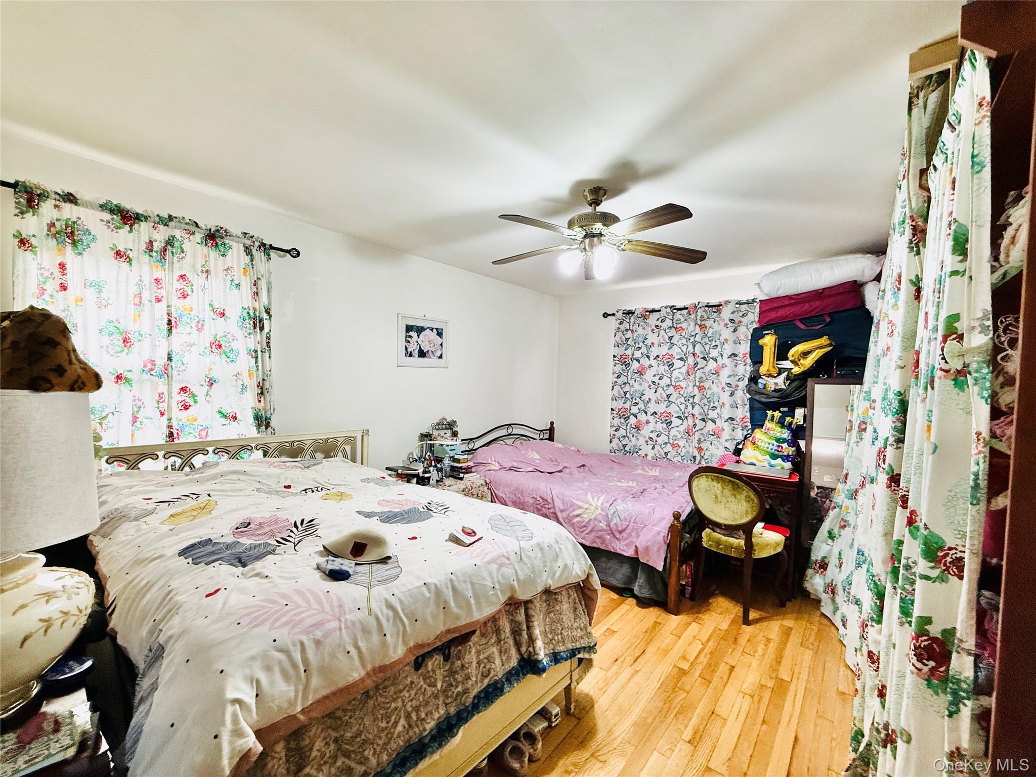 2154 Haight Avenue Bronx, NY 10461 - Photo 30 of 40 a bedroom with bed and a chandelier