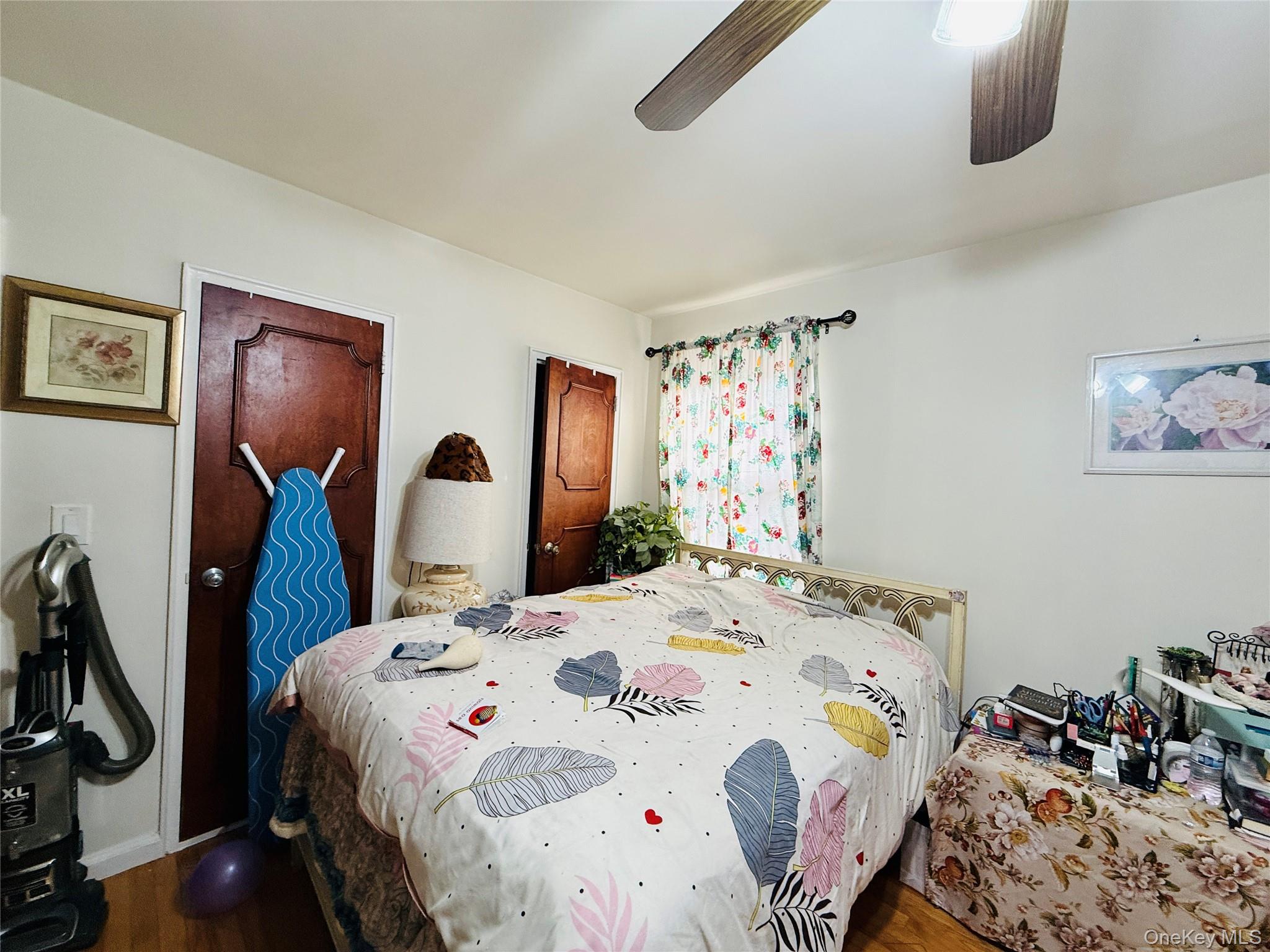 2154 Haight Avenue Bronx, NY 10461 - Photo 31 of 40 a bedroom with bed and wooden floor