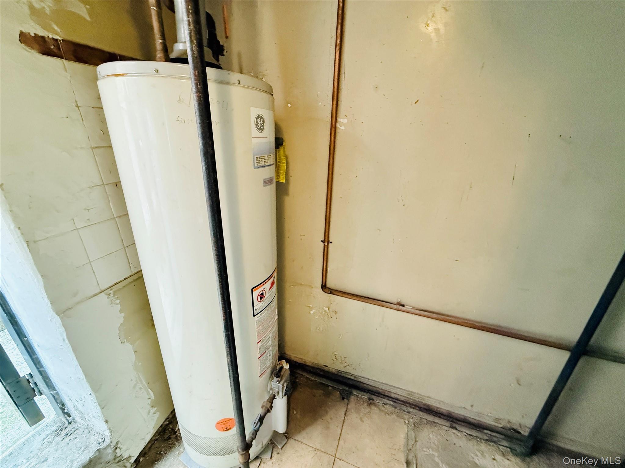 2154 Haight Avenue Bronx, NY 10461 - Photo 34 of 40 a view of storage and utility room with refrigerator