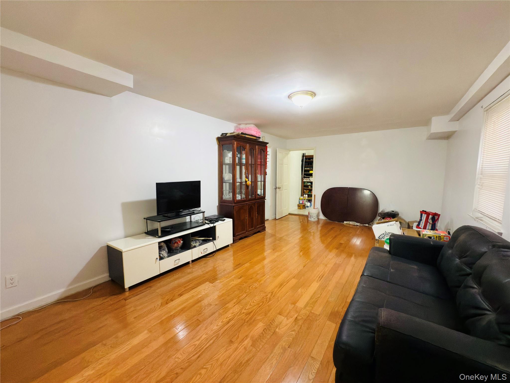 2154 Haight Avenue Bronx, NY 10461 - Photo 5 of 40 a living room with furniture and a flat screen tv