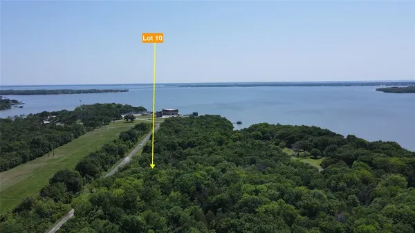 an aerial view of a city with ocean view