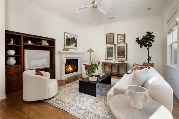 a living room with furniture and a fireplace