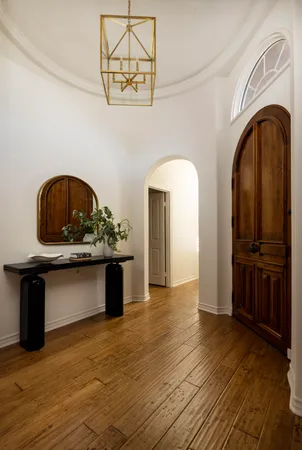 a view of living room with furniture and wooden floor