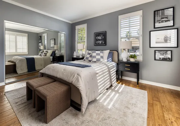 a bedroom with a bed and a couch