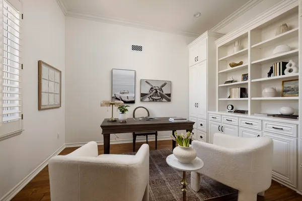 a living room with furniture and a chair