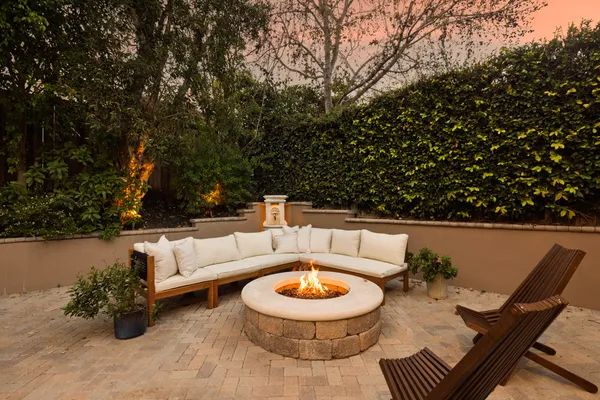 a view of outdoor sitting area with furniture and wooden floor