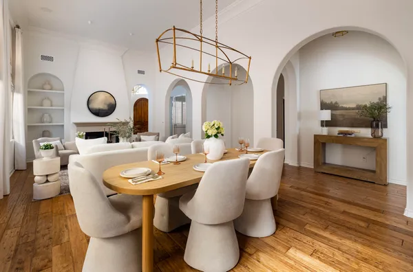 a living room with furniture and a mirror