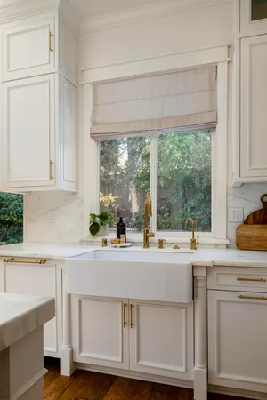 a kitchen with a sink and cabinets