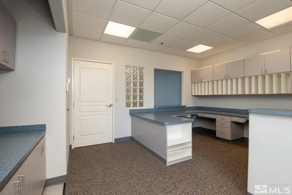 a living room with furniture a dining table and chairs