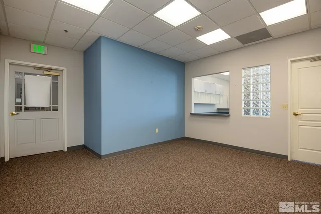 a kitchen with a stove and a refrigerator