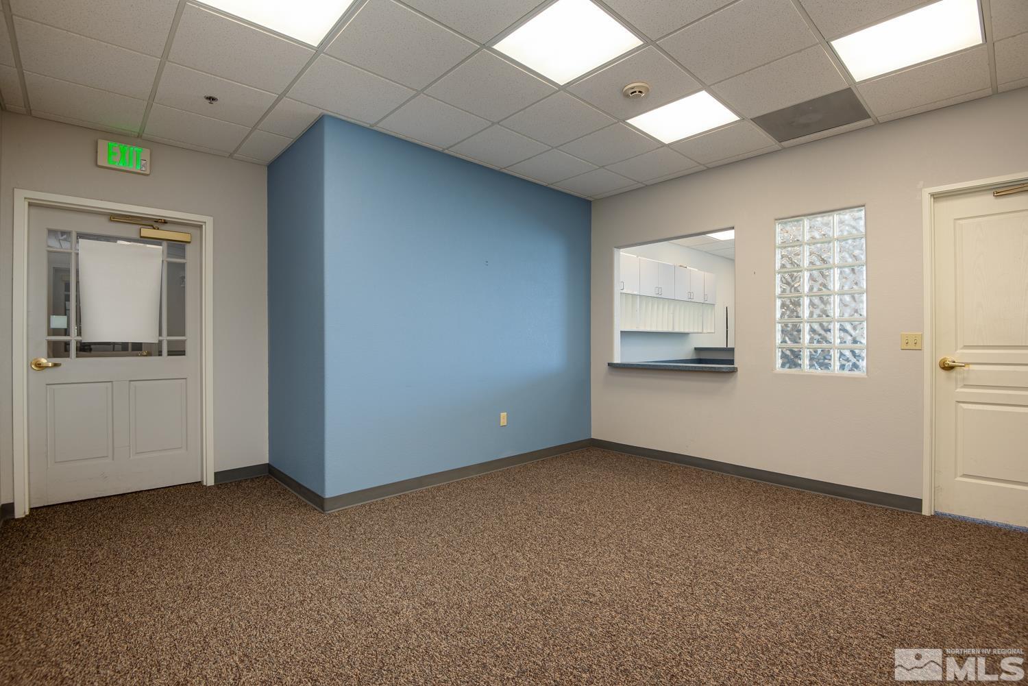 5 Pine Cone Road, Unit 105 Dayton, NV 89403 - Photo 10 of 12 an empty room with cabinet and windows