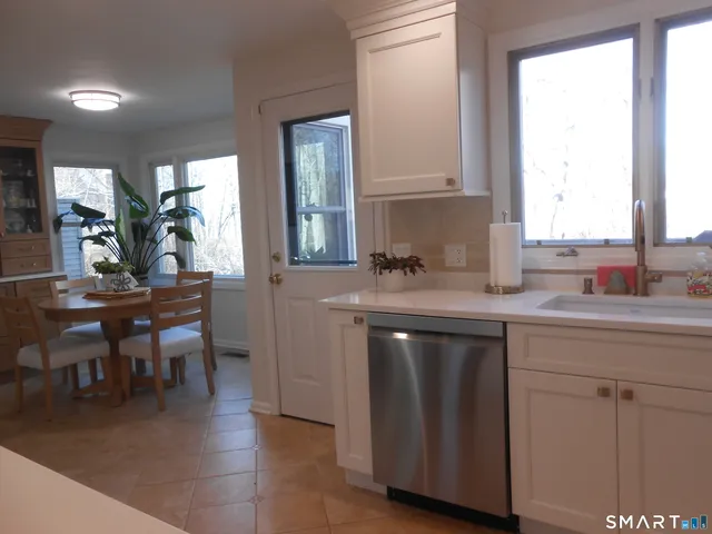 a kitchen with sink and cabinets