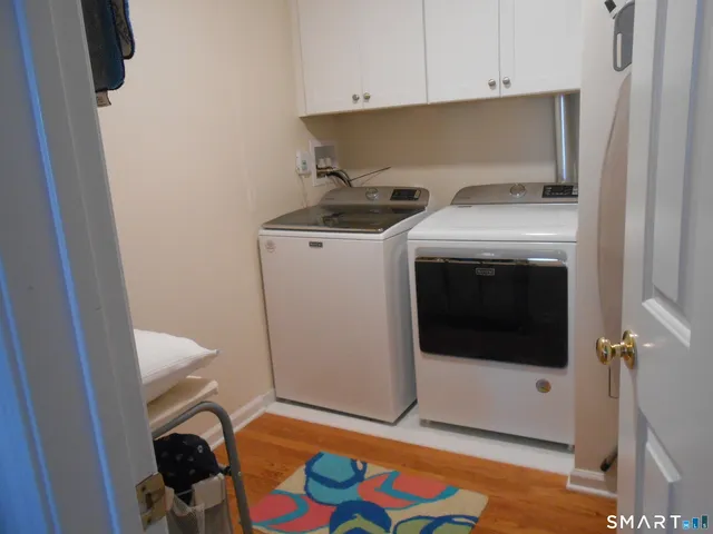 a bedroom with a bed and a mirror