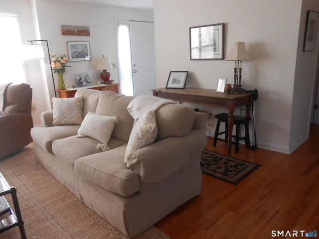 a living room with furniture and a table