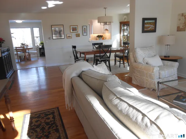 a living room with furniture or couch and a dining table