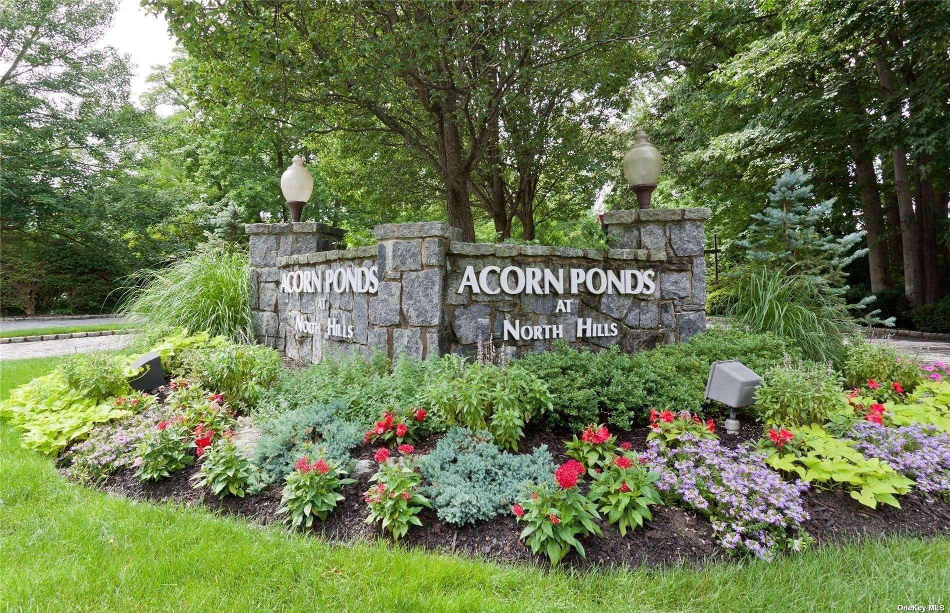 28 Pheasant Run, Unit 28 Roslyn, NY 11576 - Photo 1 of 1 a view of sign board with yard and green space