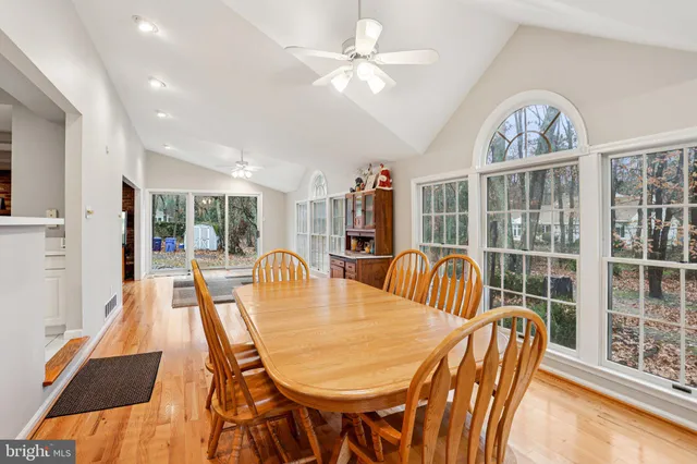 a bathroom with a granite countertop sink and a toilet