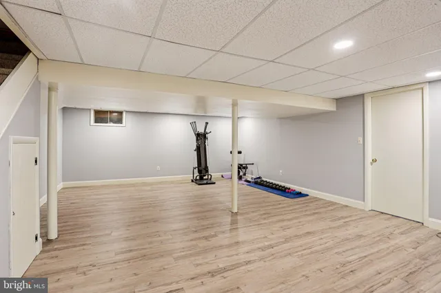 a bedroom with a bed and a ceiling fan