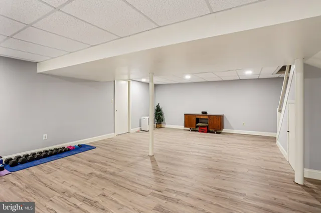 a bedroom with bed and a bookshelf
