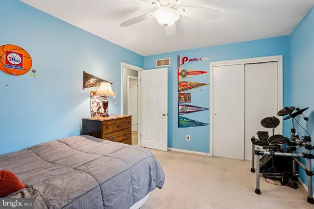 an aerial view of a house with a yard basket ball court and outdoor seating