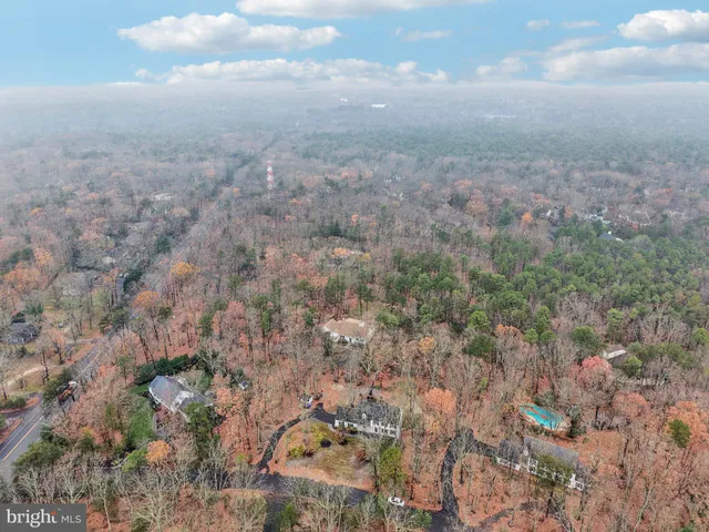 a front view of a building with parking area