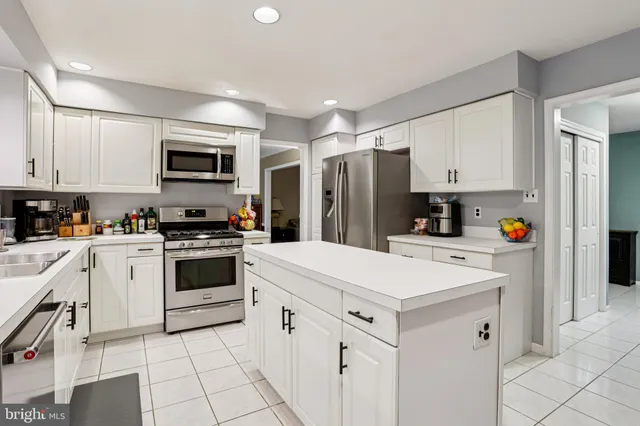 a living room filled with furniture and a flat screen tv