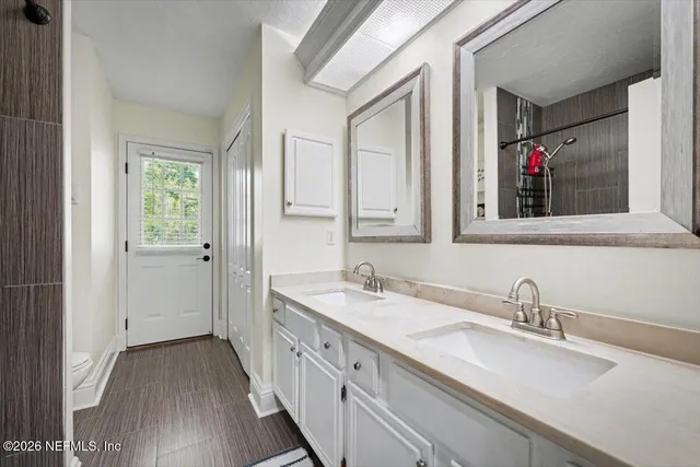 a bathroom with a toilet and shower