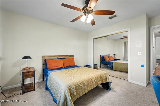 a spacious bathroom with a tub a double vanity sink a window a mirror and shower