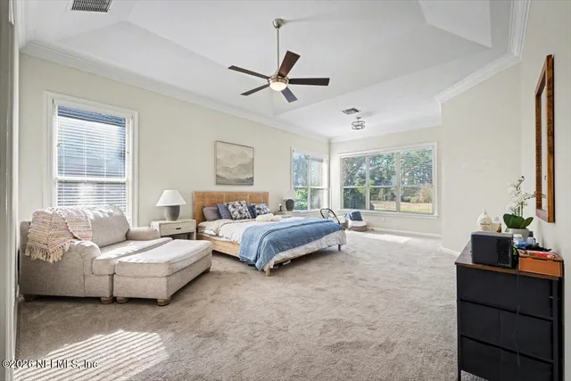 a large bathroom with a double vanity sink a mirror a bathtub and shower