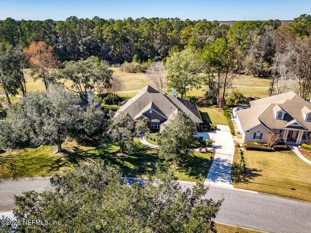an aerial view of residential house with outdoor space