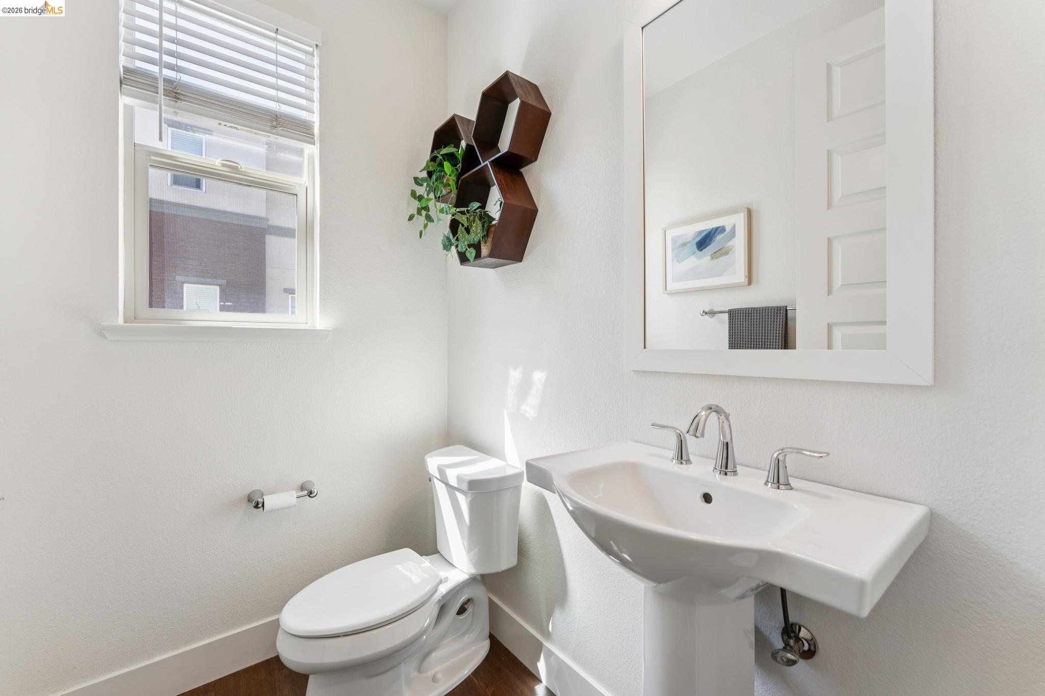 489 Diller Street Alameda, CA 94501 - Photo 21 of 60 Half bathroom with toilet and dark wood-style flooring