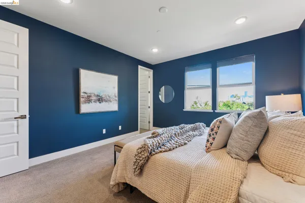 a bedroom with a bed and a walk in closet