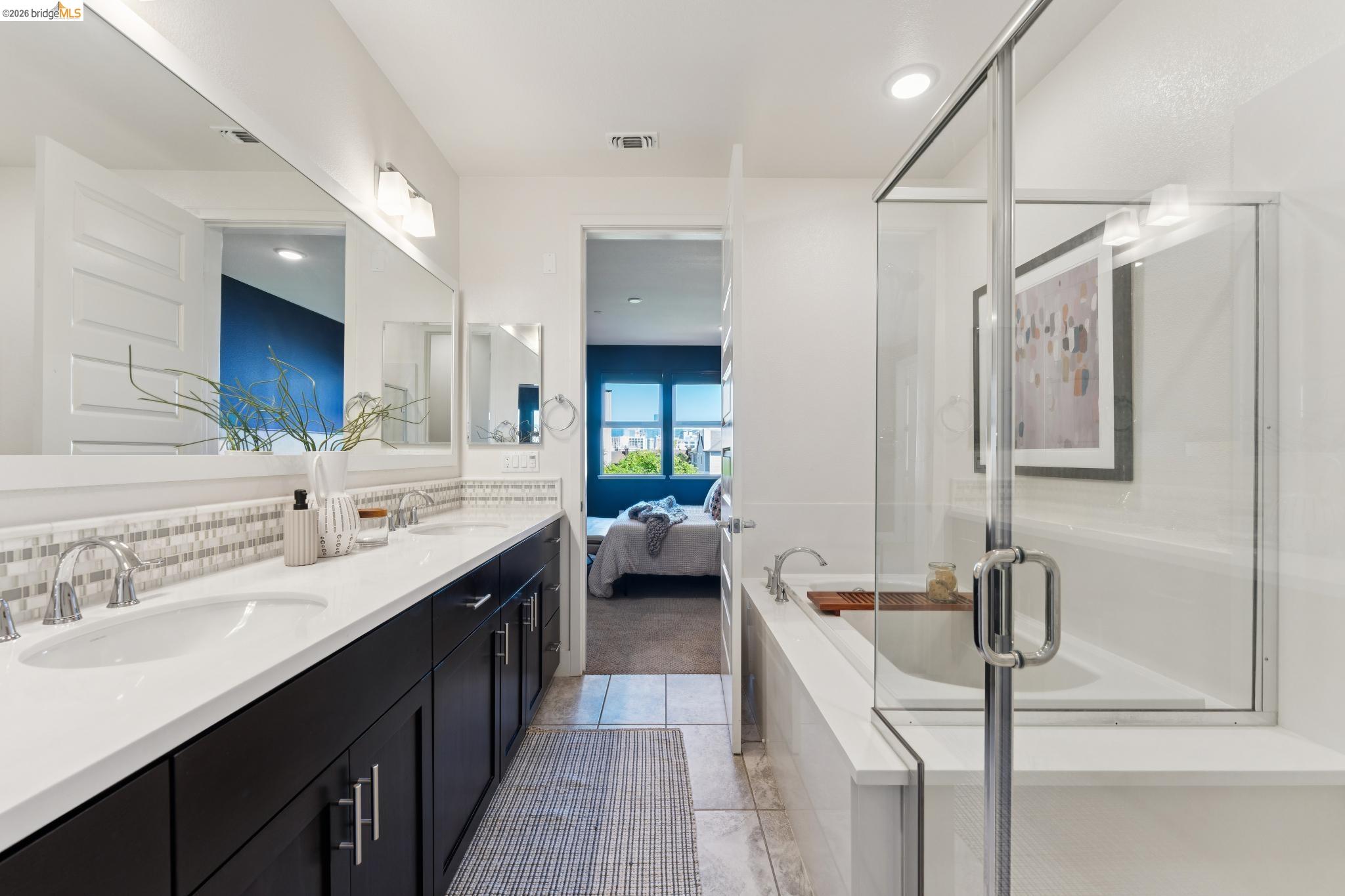 489 Diller Street Alameda, CA 94501 - Photo 35 of 60 Ensuite bathroom with double vanity, a stall shower, a bath, and light tile patterned floors