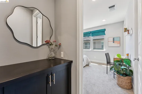 a bedroom with a bed and a view of bathroom
